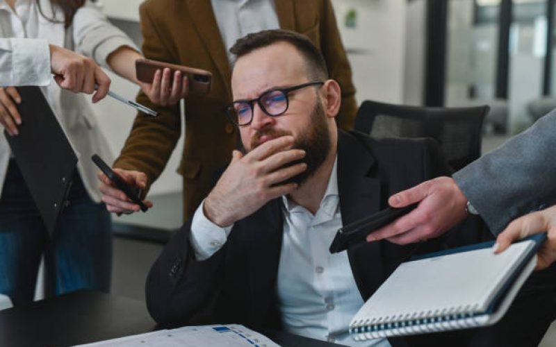 Business owner reviewing financial reports to improve financial visibility and confidence during business growth | Molinari Oswald CPAs & Business Advisors