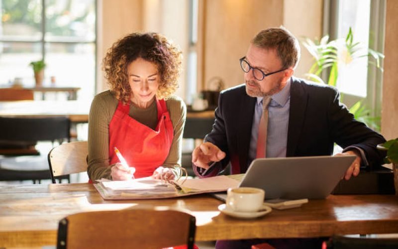 Business owner reviewing year-round tax planning and financial strategy with a CPA | Molinari Oswald CPAs & Business Advisors